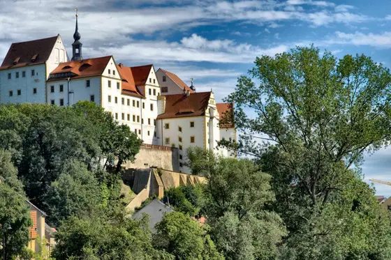 Schloss Colditz über den Baumwipfeln – eine der Jugendherbergen, in denen LevelUp-Camps stattfinden